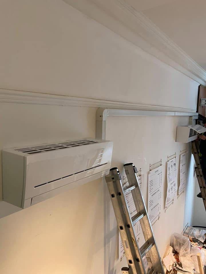 Wall-mounted split unit installation in progress