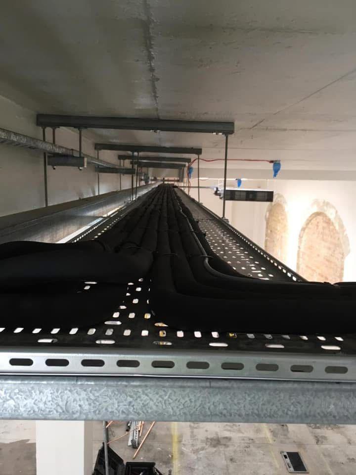 Insulated pipework runs in commercial building